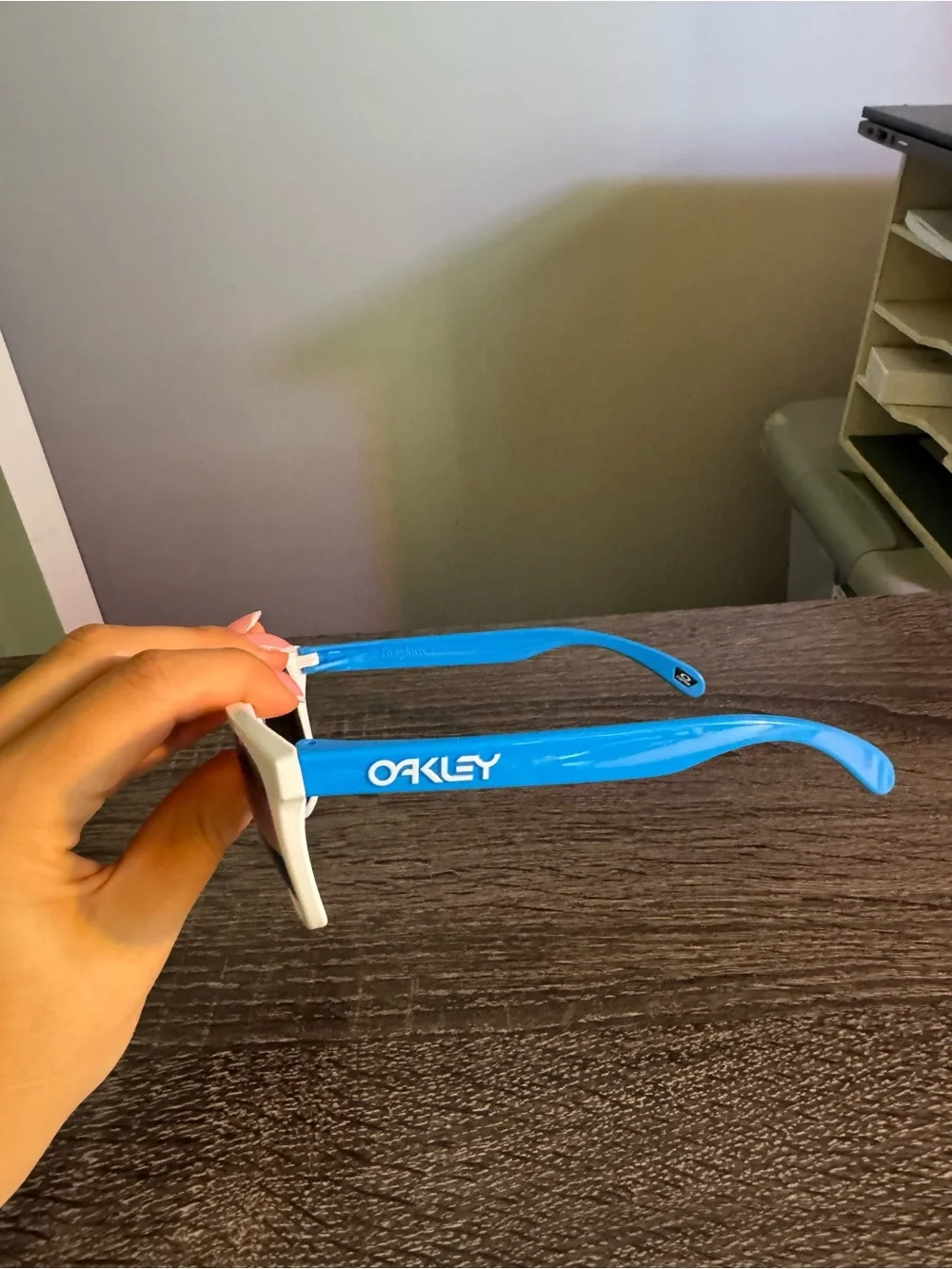 Oakley White Frame Sunglasses with Blue Mirrored Lenses